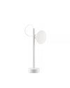 White Tsumiki table lamp by Alessi, featuring a rounded head, cylindrical stand, and curved top element.