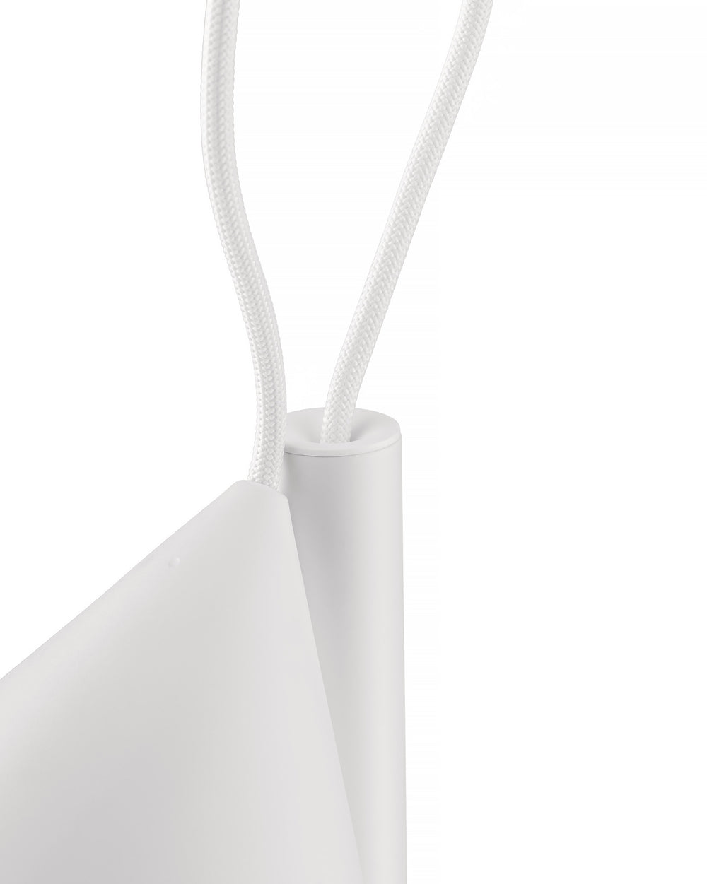 White Tsumiki lamp by Alessi with braided cords entering cylindrical and conical elements, close-up.