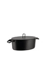Black oval casserole by Alessi with a matte finish and loop lid handle.