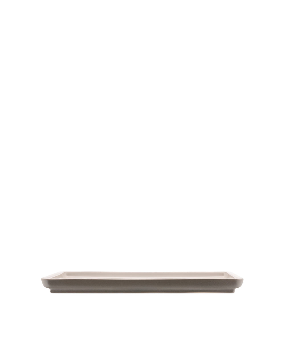 Rectangular taupe ceramic platter by Alessi, with subtly curved edges, presented from a side view.
