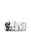 Decorative basket in polished silver metal by Alessi, with a coral-inspired cut-out design.