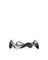 Silver metallic wavy spoon rest by Alessi, named BLIP, with a highly polished, reflective finish.