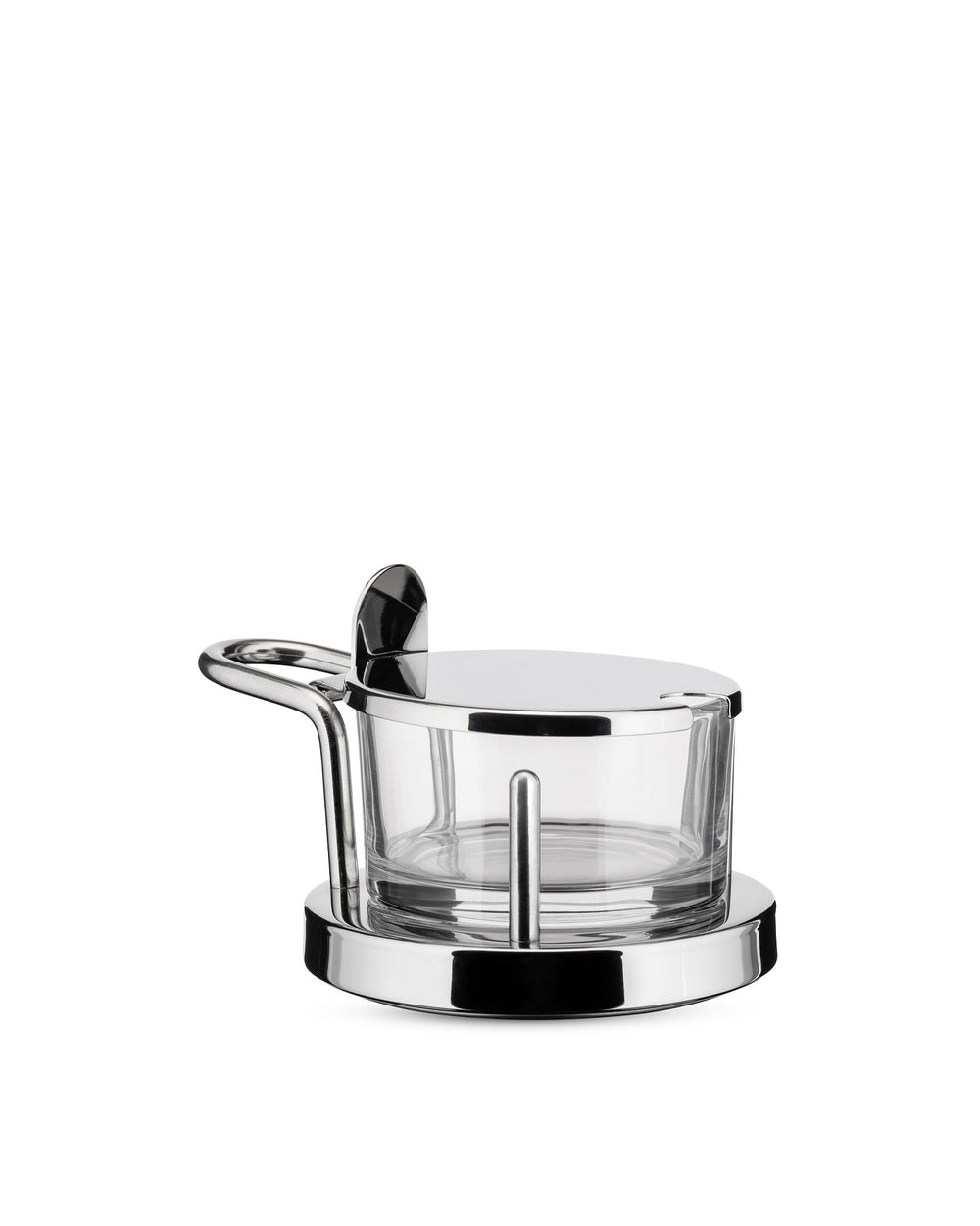 Chrome and glass cheese cellar by Alessi with a matching lid and serving spoon on a white background.