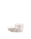 Creamy white tiered serving dish by Alessi, featuring an irregular, rock-inspired design and a smooth, glossy surface.