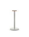 Minimalist light grey stand by Alessi, featuring a round light brown wooden top.