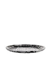 Round, polished metal faceted tray by Alessi with a geometric and highly reflective surface.