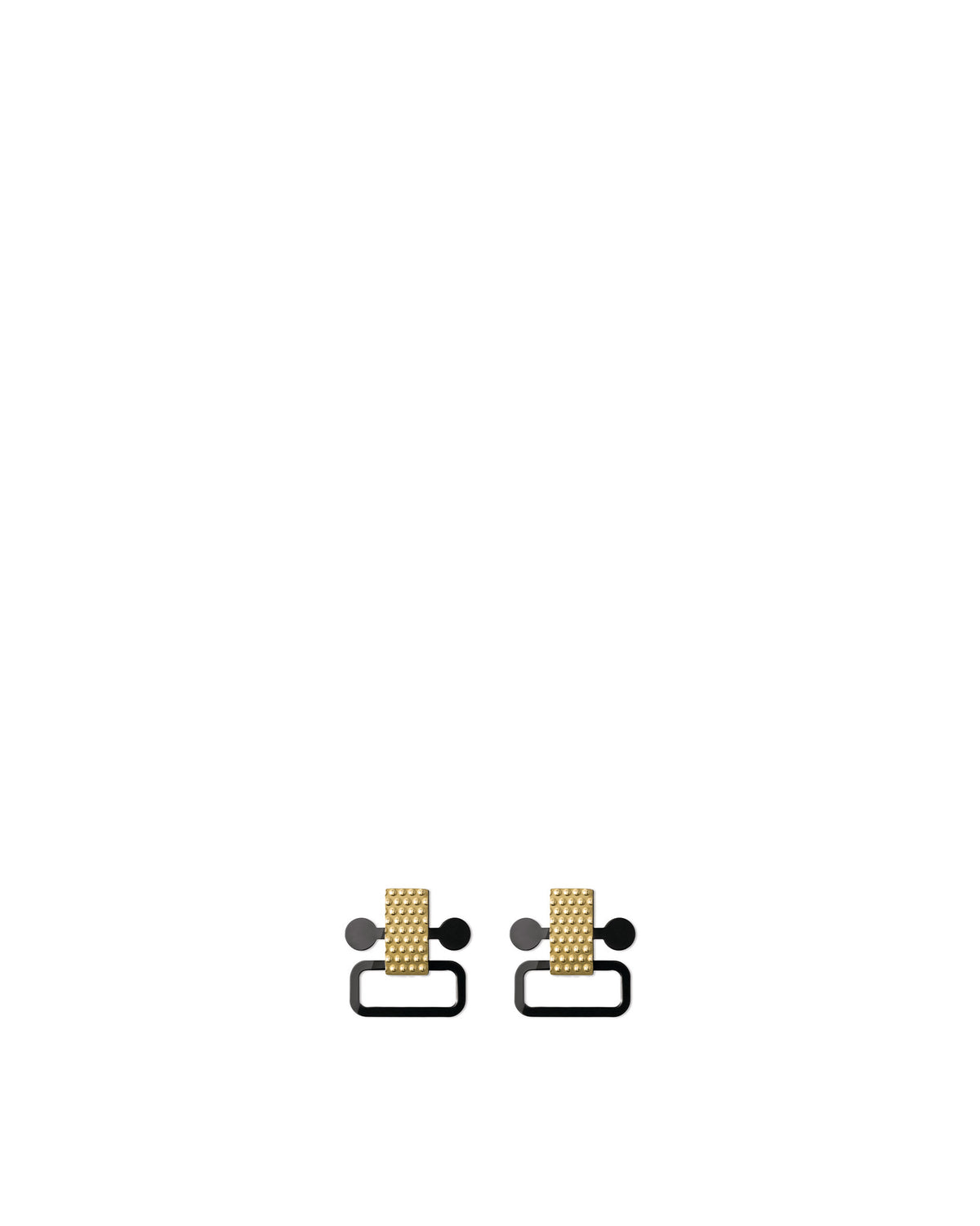 Pair of gold and black stud earrings by Alessi, featuring textured rectangular tops and smooth curved bottoms.