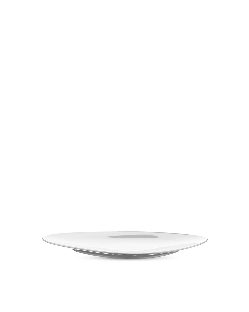 Modern white plate by Alessi, featuring a sleek, gently curved design, presented at a low angle.