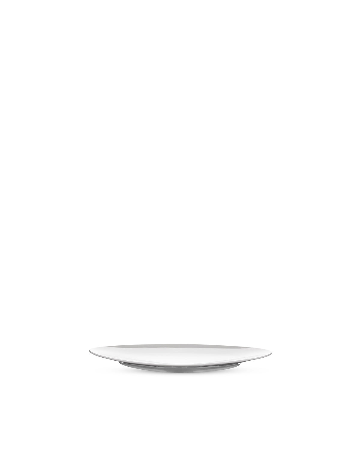 White modern plate by Alessi, minimalist design, viewed from a low angle.