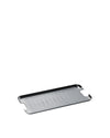 Silver stainless steel grill tray by Alessi with parallel ridges and integrated cut-out handles, angled view.