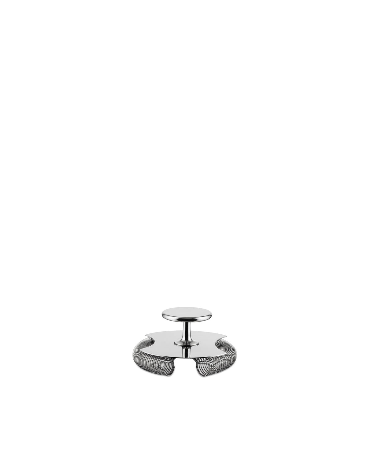 The silver metal tending box by Alessi, designed as a cocktail strainer with a central handle and coiled spring rim.