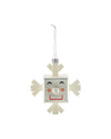 Square silver Snowray Christmas ornament by Alessi, with beige snowflake arms and a smiling face.