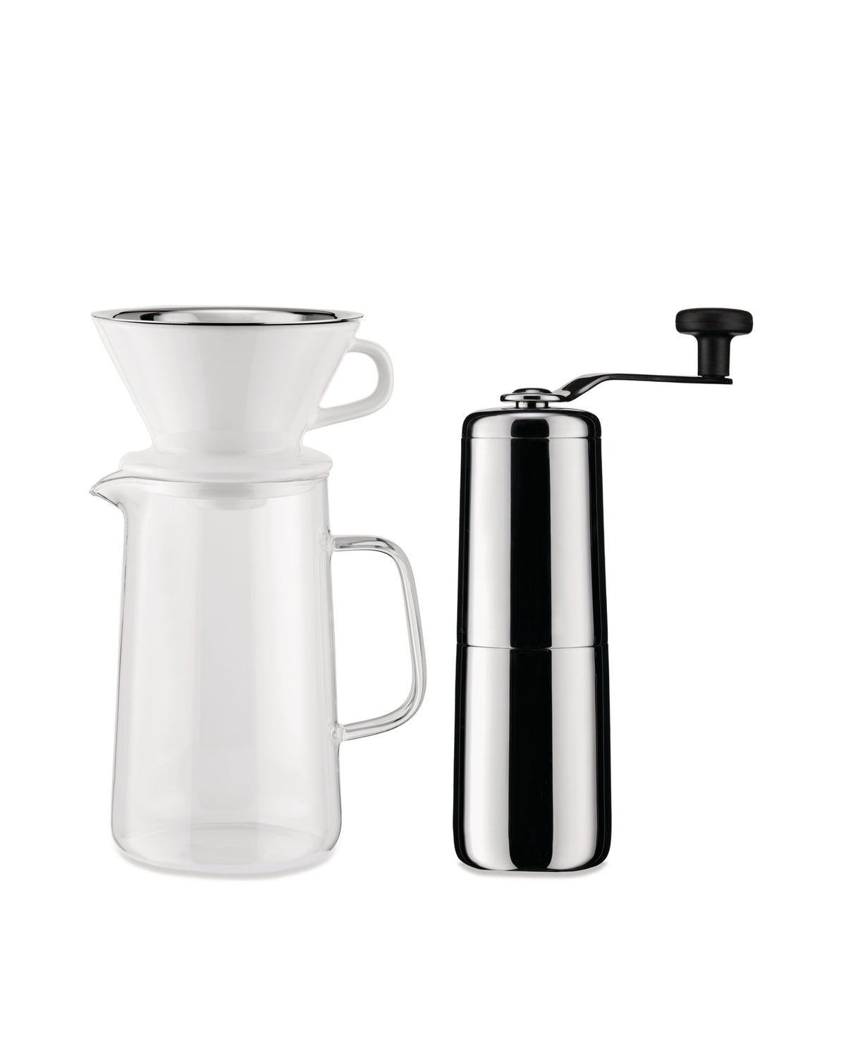 Polished chrome manual coffee grinder by Alessi, alongside a glass pour-over coffee carafe with white ceramic dripper.