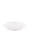 White round kitchen scale by Alessi with a ridged base and two subtle touch controls on the surface.