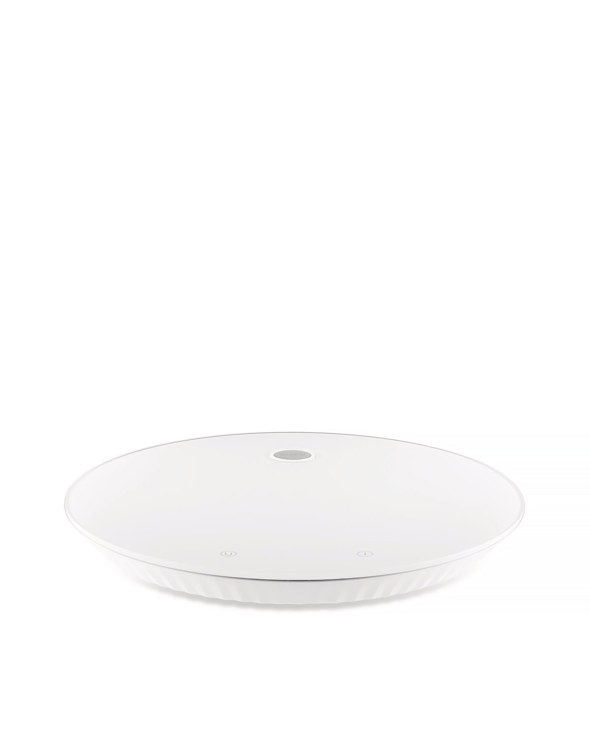 White round kitchen scale by Alessi with a ridged base and two subtle touch controls on the surface.
