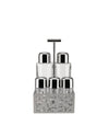 Silver oil cruet and shaker set by Alessi with clear glass bottles and an abstract geometric stand.
