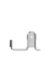 Shiny chrome metal hook by Alessi with a serrated edge and a central hanging loop featuring an A-shaped cutout.
