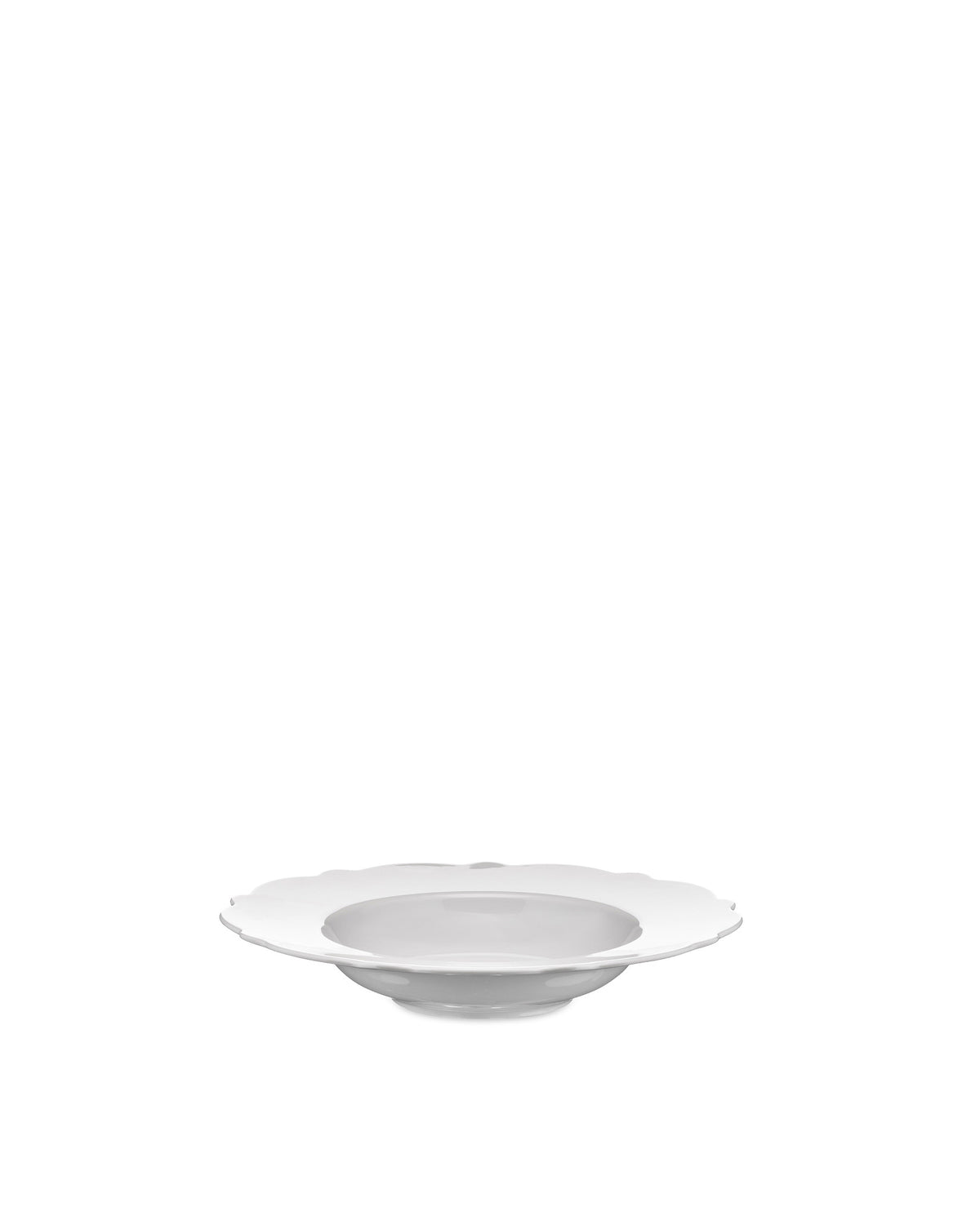 White porcelain soup plate by Alessi with a scalloped edge and shallow bowl, presented at a slight angle.