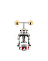 Metallic strongman corkscrew by Alessi, with black and white stripes, holding golden spheres, on a red and white triangular base.