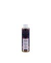 Home fragrance refill bottle with a floral label by Alessi, featuring a dark botanical pattern and a white ribbed cap, filled with golden liquid.