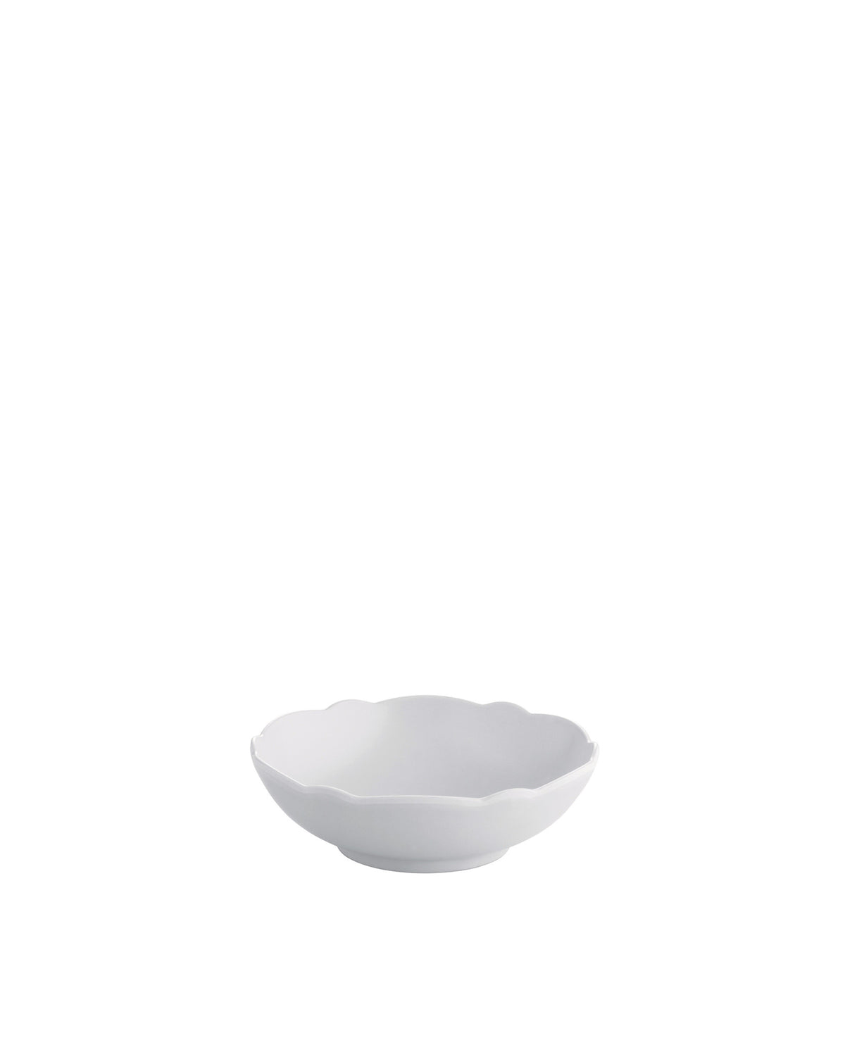 White bowl by Alessi with a distinctive scalloped rim, viewed from a slight angle.