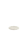 Light beige serving tray by Alessi with intricate swirl pattern and scalloped edges.