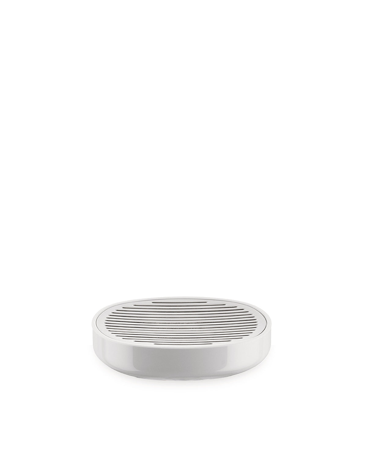 White oval soap dish by Alessi with a slatted draining top, shot from a slightly elevated front view.