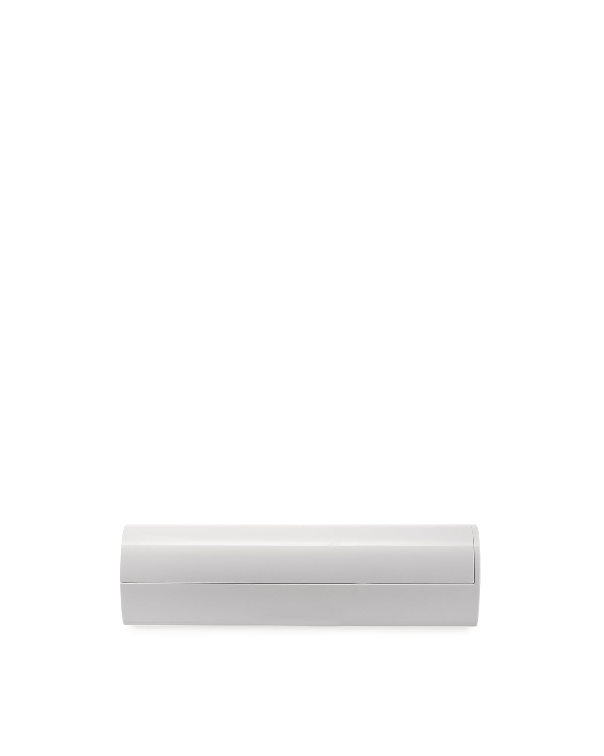 White Birillo container by Alessi, a sleek, minimalist design with a horizontal seam.