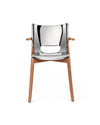 Silver chrome chair with wooden arms and legs by Alessi, featuring a sleek, reflective finish and a cutout detail.