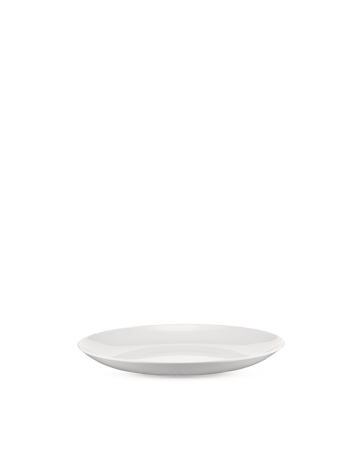 White, shallow oval plate by Alessi with a glossy finish, viewed from a low angle.
