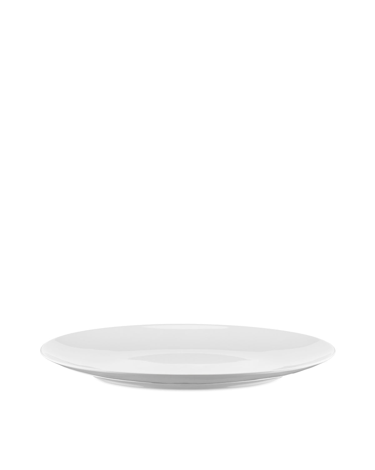White round plate by Alessi with a smooth surface and subtly curved rim, shown from a low angle.