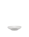 White bowl by Alessi, a simple, shallow serving bowl with a subtle elevated base, from a slightly elevated angle.