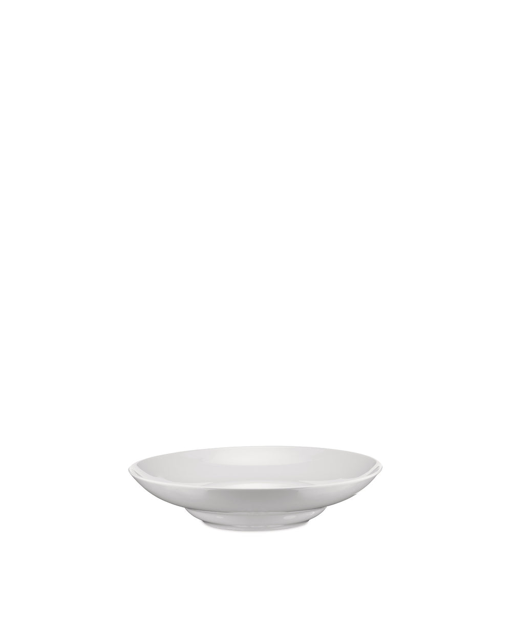 White bowl by Alessi, a simple, shallow serving bowl with a subtle elevated base, from a slightly elevated angle.