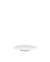 A round white plate by Alessi, shown from a low angle.
