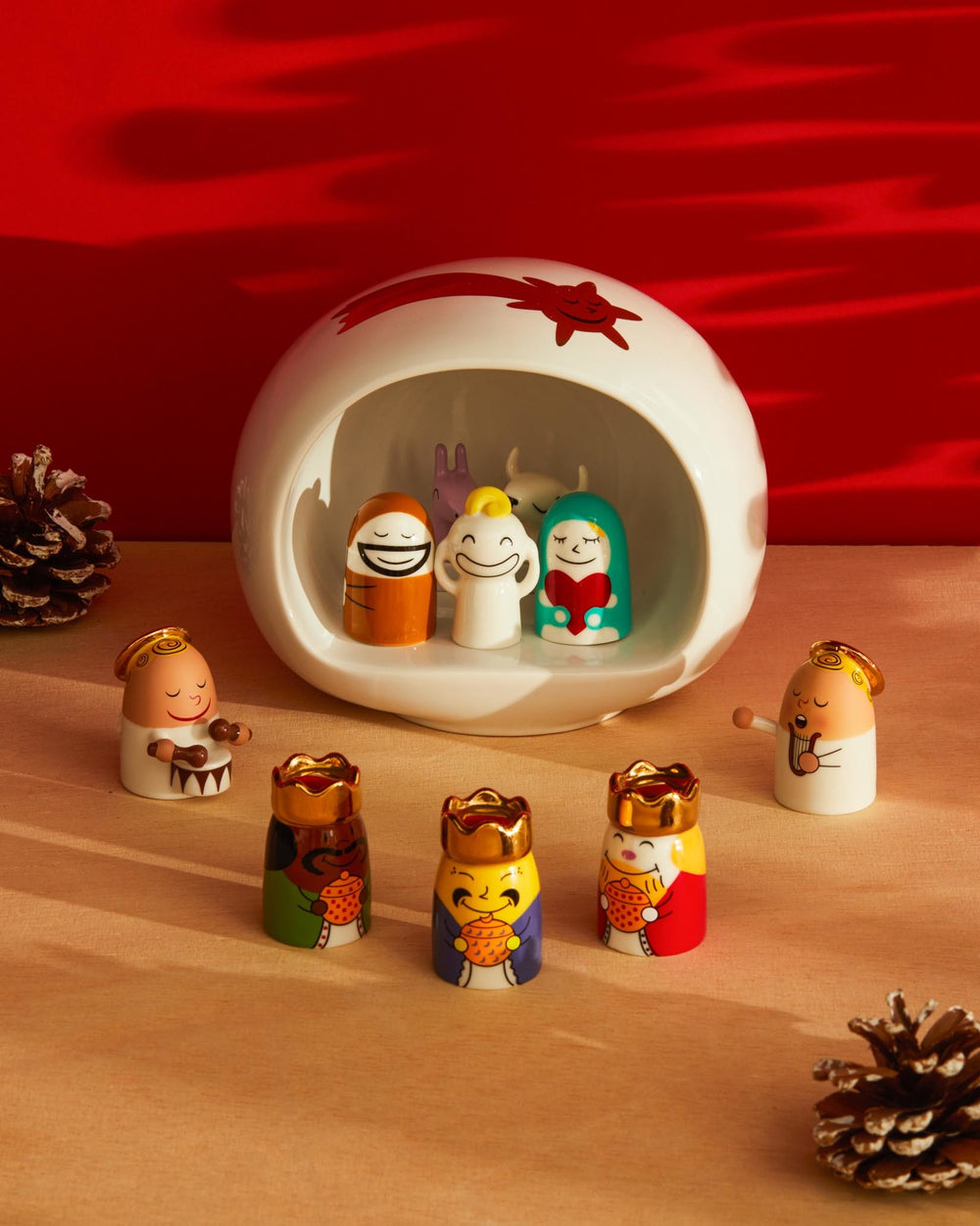 Modern ceramic Presepe by Alessi featuring colorful Nativity figurines in a white stable with a red shooting star.