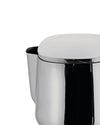 Polished stainless steel pitcher by Alessi, featuring a white dome lid and reflective surface, in a cropped view.