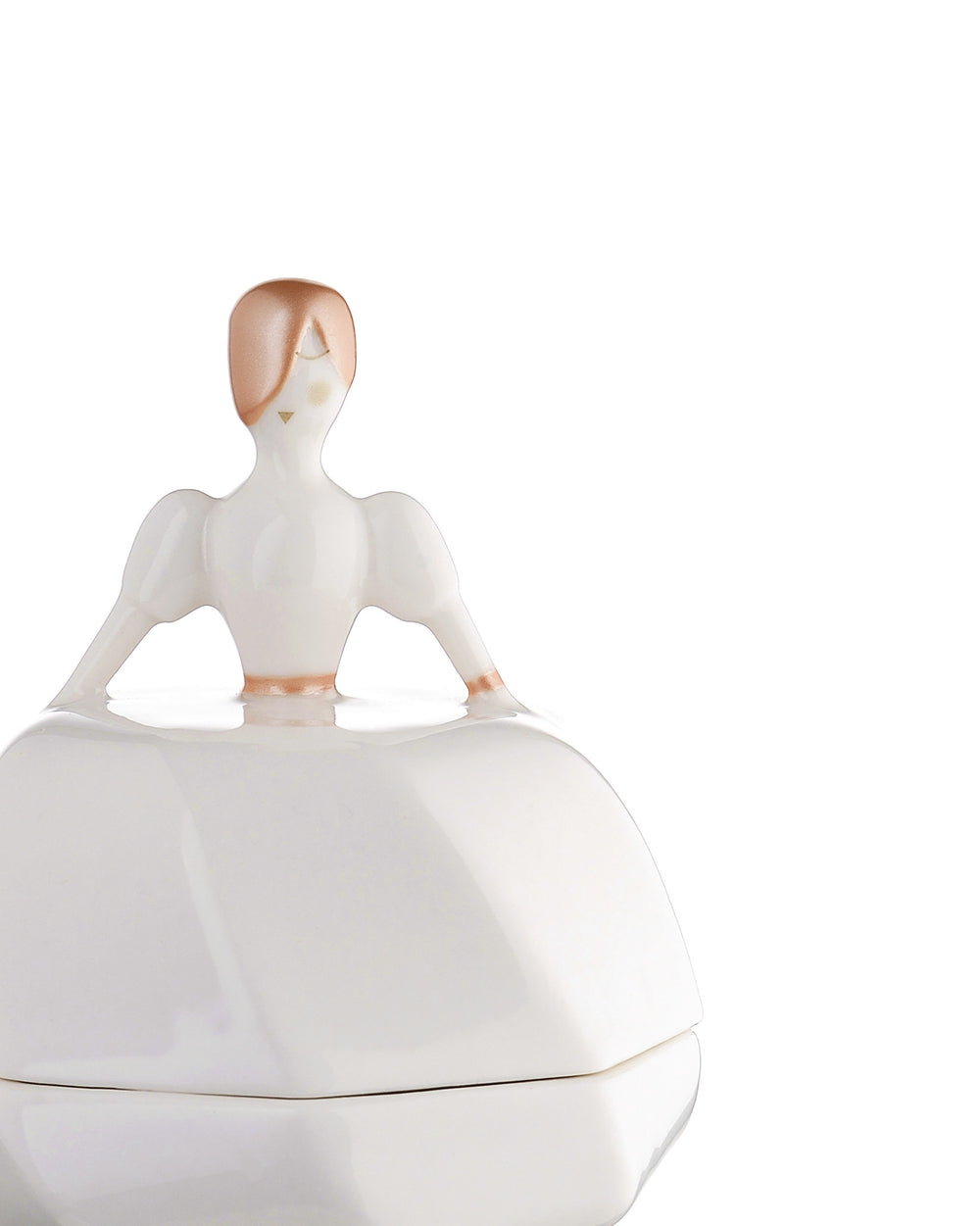 White porcelain bride figurine container by Alessi, with rose gold hair and sleeve accents, serving as a lid.