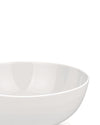 White bowl by Alessi with a smooth, curved rim and a glossy interior, shown cropped.