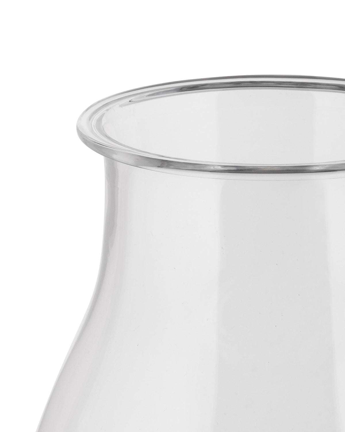 Clear glass Tonale pitcher by Alessi, showing a close-up of its subtly curved rim.