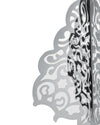 Silvery, multi-layered Christmas decorative screen by Alessi, with intricate abstract cutouts and reflective surfaces, side view.