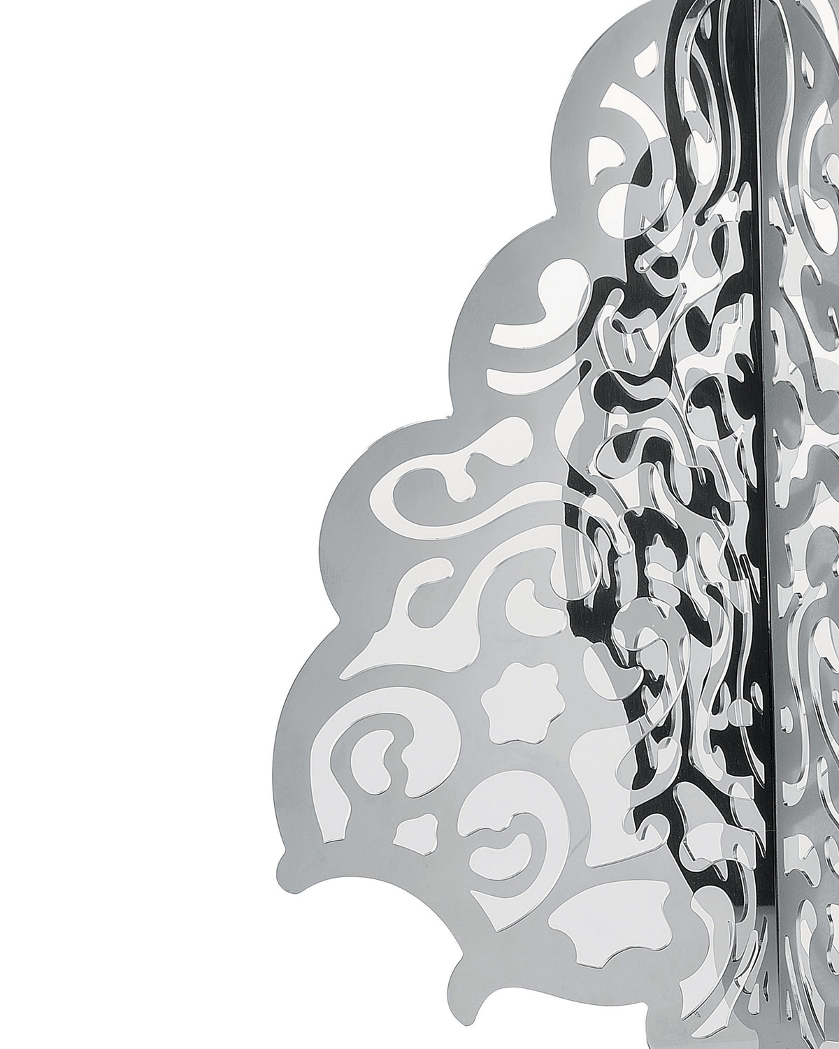 Silvery, multi-layered Christmas decorative screen by Alessi, with intricate abstract cutouts and reflective surfaces, side view.