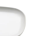White oval porcelain serving platter by Alessi, with a smooth, glossy finish and gently curved edge.