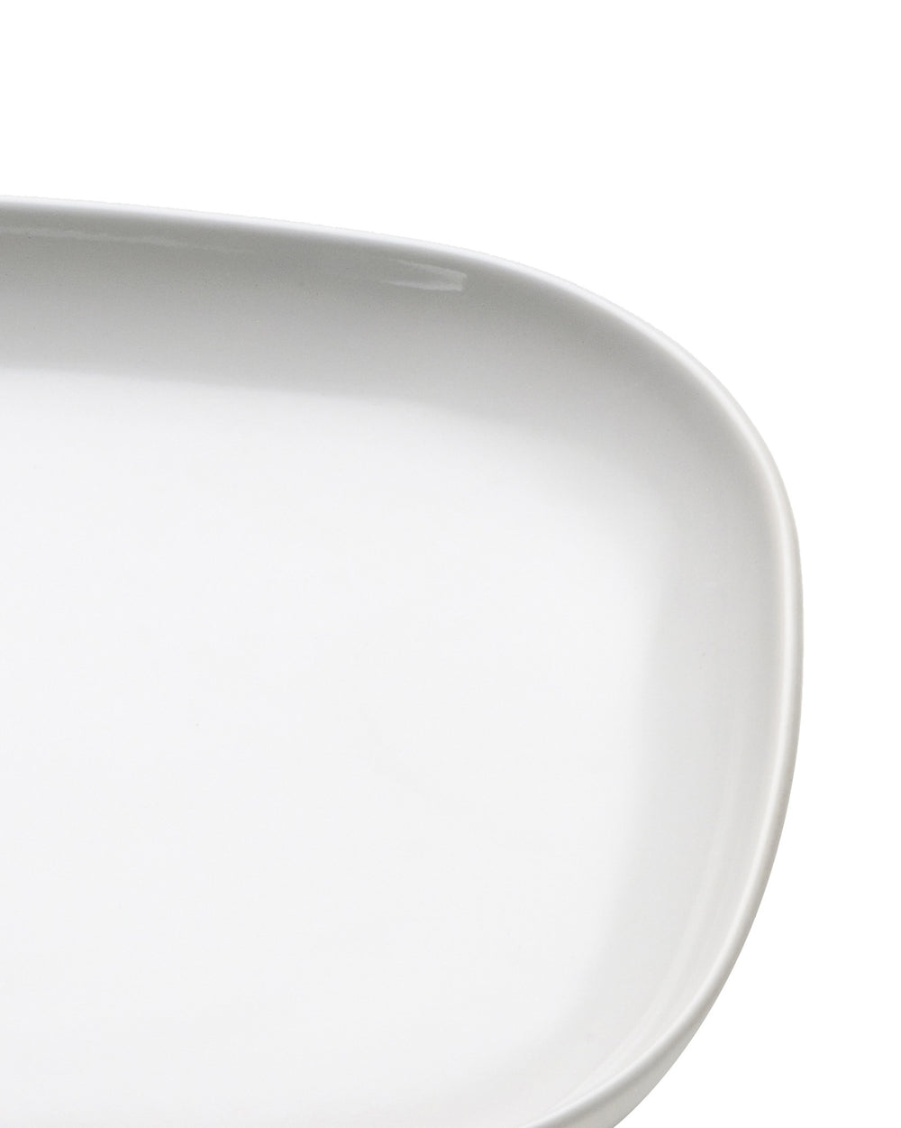 White oval porcelain serving platter by Alessi, with a smooth, glossy finish and gently curved edge.