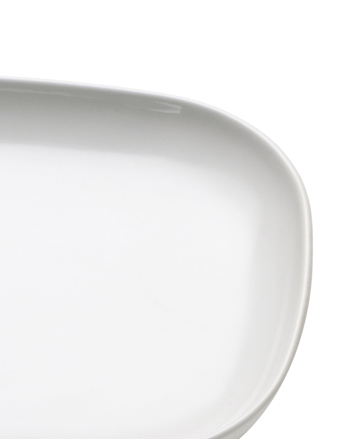 White oval porcelain serving platter by Alessi, with a smooth, glossy finish and gently curved edge.