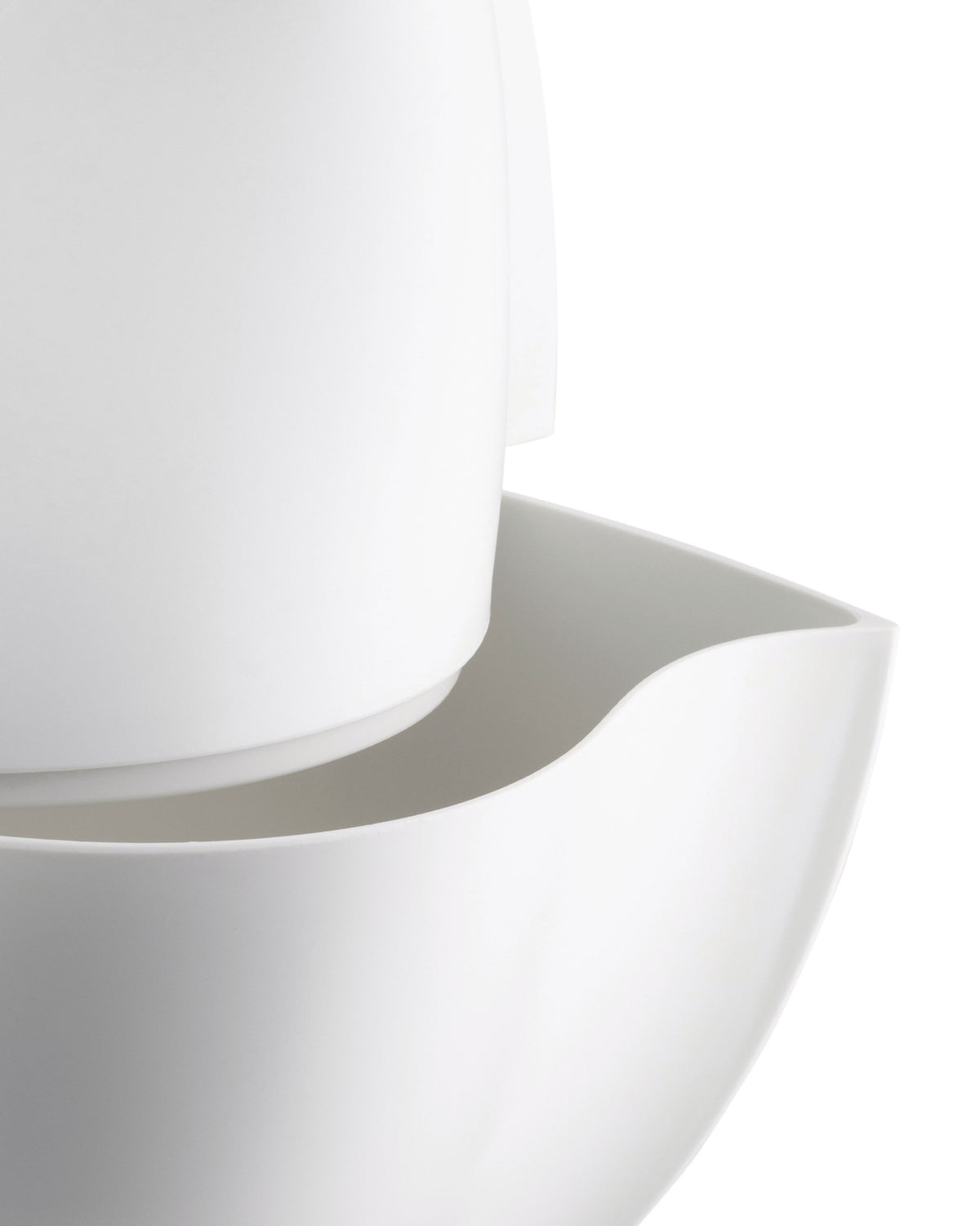 White, smooth, minimalist pitcher by Alessi, featuring a curved spout and stacked components.
