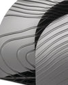 Grey metallic veneer by Alessi with a glossy finish and abstract wavy, linear patterns.