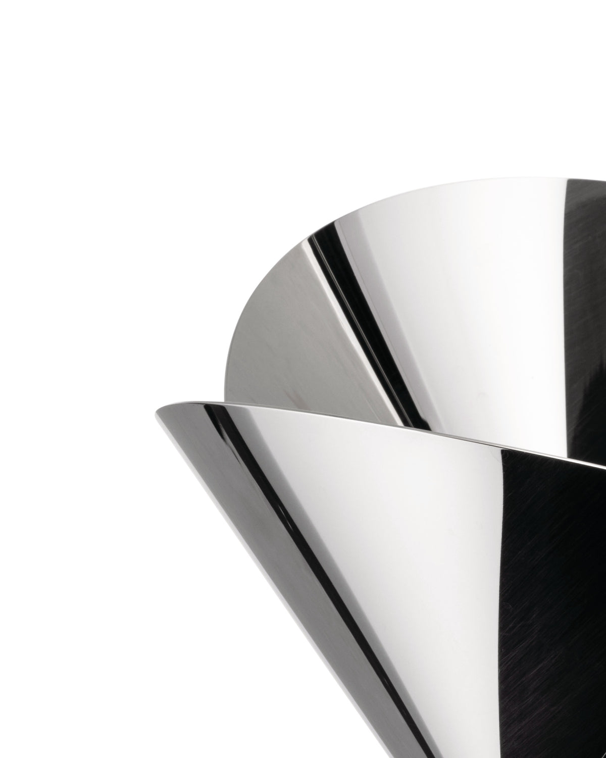 Metallic basket by Alessi with a sculptural, layered design and highly reflective surface.