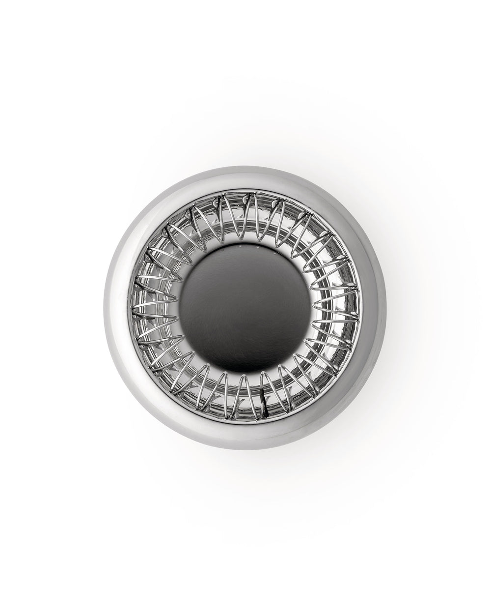Round Spirale fruit holder by Alessi, polished metal with a distinctive wire spiral design, top-down on white.