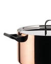Copper cooking pot by Alessi with a black side handle and a reflective stainless steel lid, shown cropped.