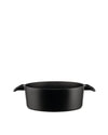 Black cast iron pot by Alessi, with a low profile and two small side handles, side view.